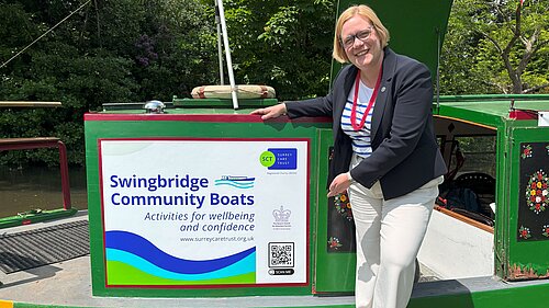 Zöe Franklin next to Swingbridge Community Boats "Maggie G"