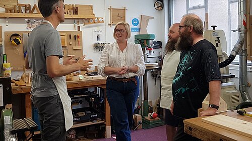 Zoe talking to voters in young persons skill development area